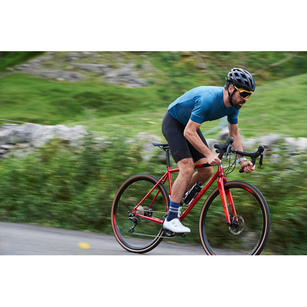 Equilibrium Disc Large Road Bike – Reynolds 725 Tubing, Shimano 105, Hydraulic Disc Brakes – Red 18 Equilibrium Disc Large Red bike on light gravel path
