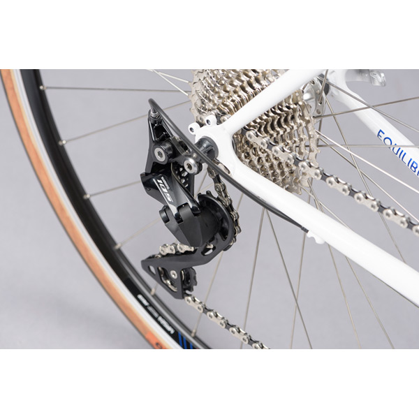 Equilibrium Large White Steel Road Bike – Lightweight Reynolds 725 Frame, Timeless Comfort 8 Rear Derailleur of Equilibrium Large White Steel Road Bike with Reynolds 725 frame